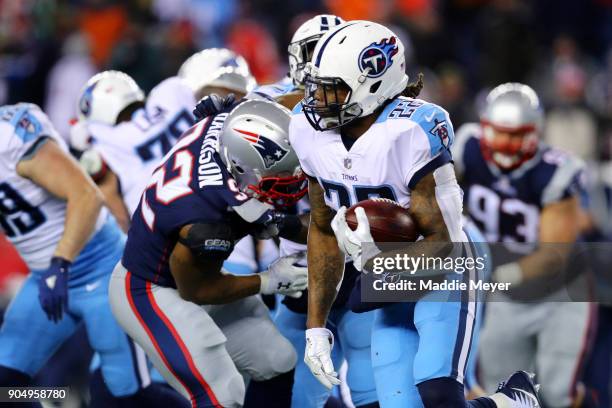 Derrick Henry of the Tennessee Titans runs the ball against the New England Patriots during the AFC Divisional Playoff game at Gillette Stadium on...