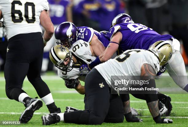 Harrison Smith of the Minnesota Vikings sacks Drew Brees of the New Orleans Saints in the second quarter of the NFC Divisional Playoff game on...