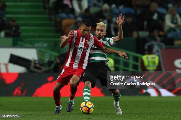 Aves midfielder Claudio Falcao from Brasil vies with Sporting CP forward Ruben Ribeiro from Portugal for the ball possession during the Portuguese...