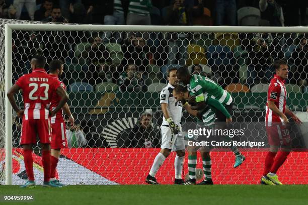 Sporting CP forward Bas Dost from Holland celebrates scoring Sporting second goal with Sporting CP midfielder William Carvalho from Portugal during...