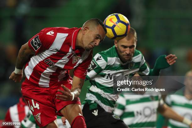 Aves defender Diego Galob from Brazil vies with Sporting CP forward Bas Dost from Holland for the ball possession during the Portuguese Primeira Liga...