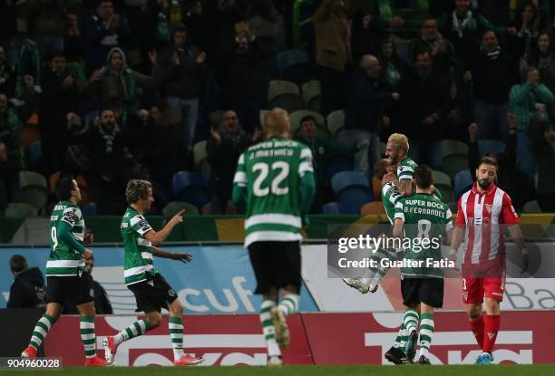 Sporting CP forward Bas Dost from Holland celebrates with teammates after scoring a goal during the Primeira Liga match between Sporting CP and CD...