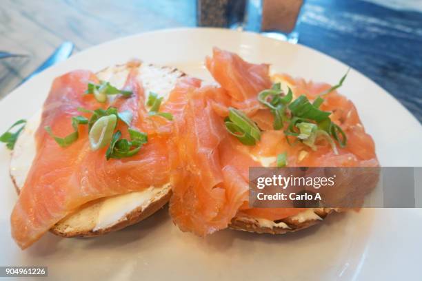 smoked salmon on bagels - smoked salmon stock pictures, royalty-free photos & images