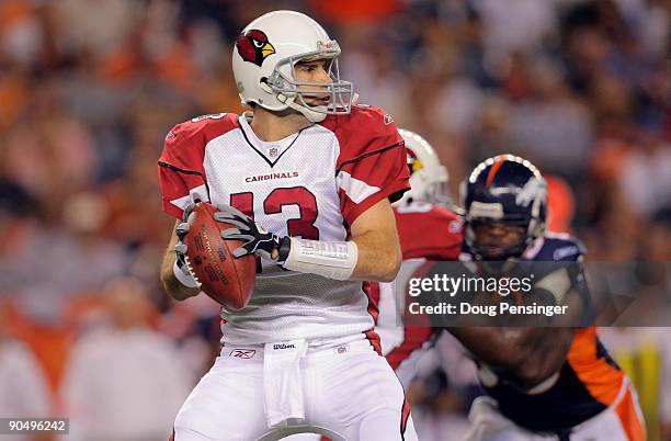 Quarterback Kurt Warner of the Arizona Cardinals looks to deliver a pass against Denver Broncos during NFL preseason action at Invesco Field at Mile...