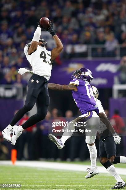 Marcus Williams of the New Orleans Saints intercepts a pass intended for Stefon Diggs of the Minnesota Vikings during the second half of the NFC...