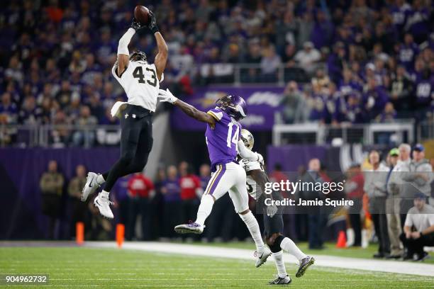 Marcus Williams of the New Orleans Saints intercepts a pass intended for Stefon Diggs of the Minnesota Vikings during the second half of the NFC...