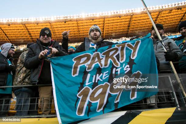 Jaguars fans celebrate during the AFC Divisional Playoff game between the Jacksonville Jaguars and the Pittsburgh Steelers on January 14, 2018 at...