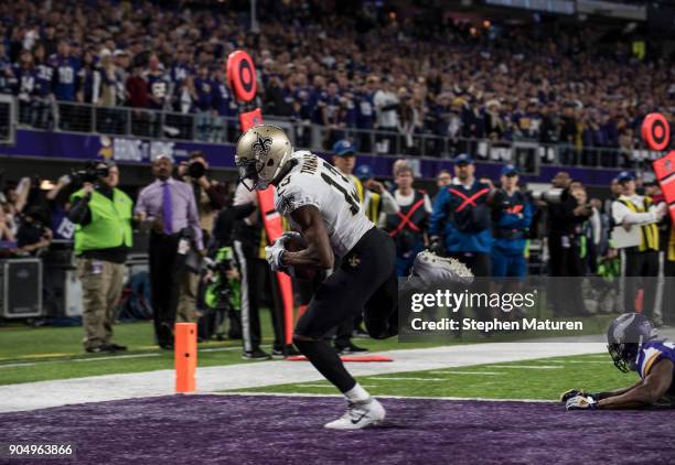 Michael Thomas of the New Orleans Saints catches the ball for a touchdown over defender Xavier Rhodes of the Minnesota Vikings in the third quarter...