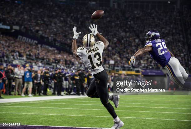 Michael Thomas of the New Orleans Saints catches the ball for a touchdown over defender Xavier Rhodes of the Minnesota Vikings in the third quarter...
