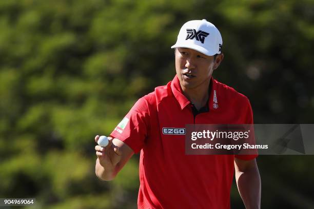 James Hahn of the United States reacts after a birdie putt on the 15th green during the final round of the Sony Open In Hawaii at Waialae Country...