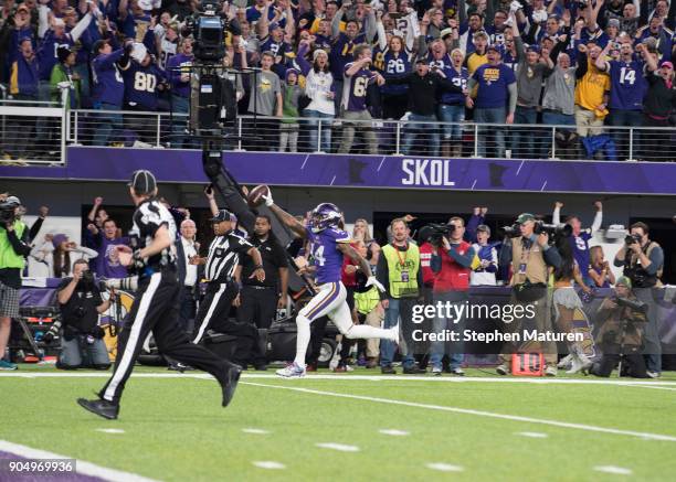 Stefon Diggs of the Minnesota Vikings runs with the ball to score a touchdown and with as time expired in the NFC Divisional Playoff game against the...