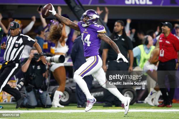 Stefon Diggs of the Minnesota Vikings scores a touchdown as time expires against the New Orleans Saints during the second half of the NFC Divisional...