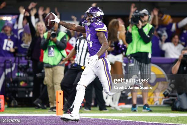 Stefon Diggs of the Minnesota Vikings scores a touchdown as time expires against the New Orleans Saints during the second half of the NFC Divisional...