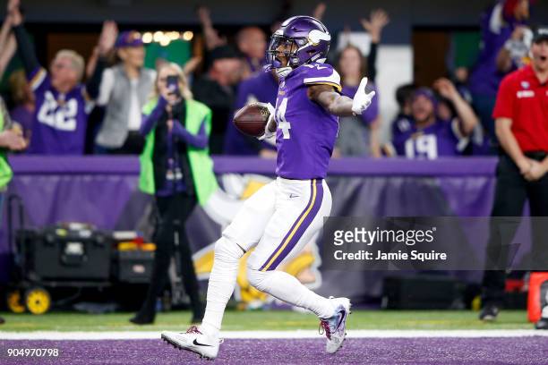 Stefon Diggs of the Minnesota Vikings celebrates after scoring a touchdown to defeat the New Orleans Saints in the NFC Divisional Playoff game at...