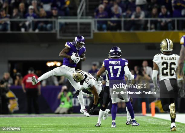 Stefon Diggs of the Minnesota Vikings leaps to catch the ball in the fourth quarter of the NFC Divisional Playoff game against the New Orleans Saints...