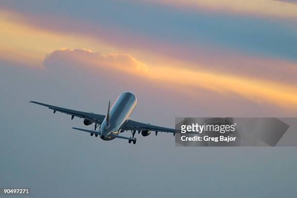 airplane taking off - greg bajor stock-fotos und bilder