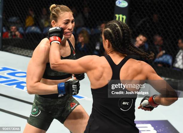 Talita Bernardo of Brazil punches Irene Aldana of Mexico in their women's bantamweight bout during the UFC Fight Night event inside the Scottrade...