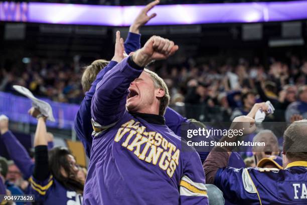 Fans react after Stefon Diggs of the Minnesota Vikings scored a 61 yard touchdown at the end of the fourth quarter of the NFC Divisional Playoff game...
