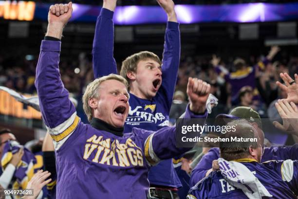 Fans react after Stefon Diggs of the Minnesota Vikings scored a 61 yard touchdown at the end of the fourth quarter of the NFC Divisional Playoff game...