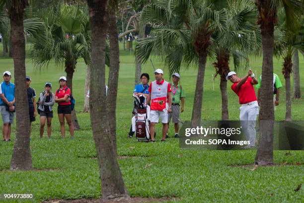 Hideto Tanihara is having a hard challenge through the trees on the last day at EurAsia Cup 2018. EurAsia Cup is a biennial men professional team...