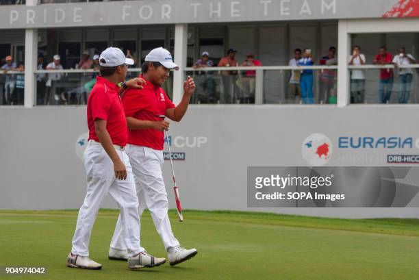 Nicholas Fung is seen encouraged Poom Sansaksin when he had won his match on the last day at EurAsia Cup 2018. EurAsia Cup is a biennial men...