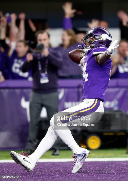 Wide receiver Stefon Diggs of the Minnesota Vikings celebrates as he runs into the endzone for the game-winning touchdown as the Vikings defeat the...