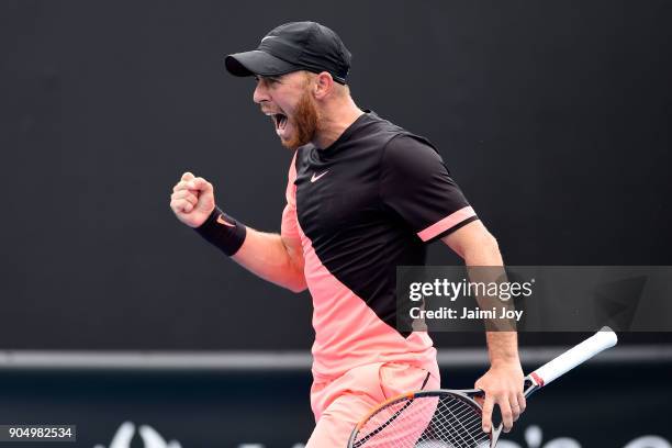 Dudi Sela of Israel celebrates a point in his first round match against Ryan Harrison of the United States on day one of the 2018 Australian Open at...