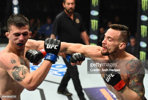 James Krause punches Alex White in their lightweight bout during the UFC Fight Night event inside the Scottrade Center on January 14, 2018 in St....