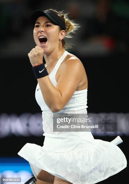 Belinda Bencic of Switzerland celebrates winning a point in her first round match against Venus Williams of the United States on day one of the 2018...
