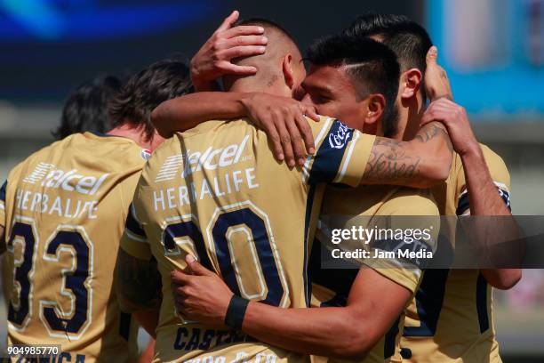 Nicolas Castillo of Pumas celebrates with teammates after scoring the first goal of his team during the second round match between Pumas UNAM and...