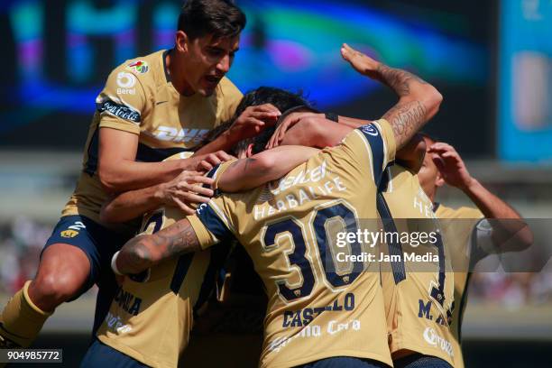 Nicolas Castillo of Pumas celebrates with teammates after scoring the first goal of his team during the second round match between Pumas UNAM and...