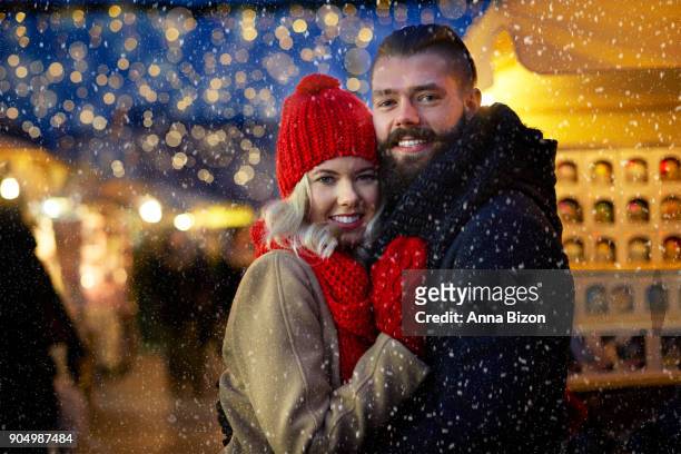 man and woman surrounded with snowflakes. cracow, poland - anna of poland fotografías e imágenes de stock