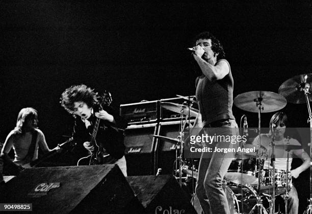 Malcolm Young, Angus Young, Bon Scott Phil Rudd from AC/DC perform live on stage in Copenhagen, Denmark in April 1977