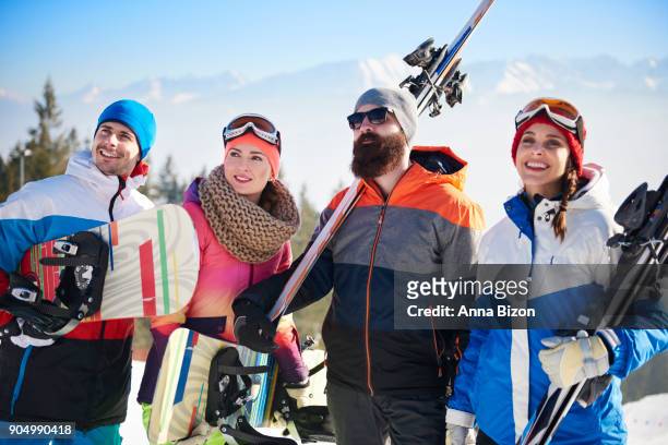 front view of young snowboarders team. zakopane, poland - anna bergman stockfoto's en -beelden