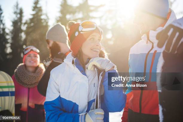 close up of affectionate snowboarders couple. zakopane, poland - anna bergman stockfoto's en -beelden