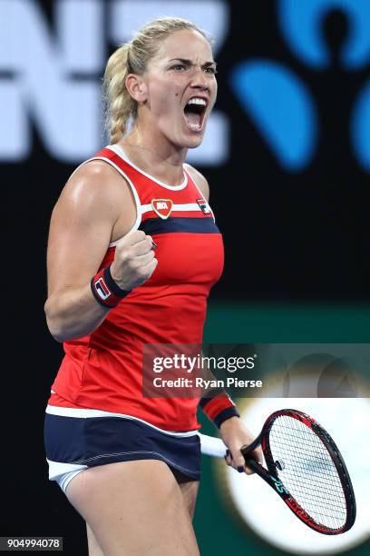 Timea Babos of Hungary celebrates winning a point in her first round match against CoCo Vandeweghe of the United States on day one of the 2018...