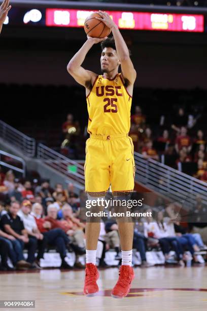 Bennie Boatwright of the USC Trojans handles the ball against Jayce Johnson of the Utah Utes during a PAC12 college basketball game at Galen Center...