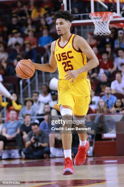 Bennie Boatwright of the USC Trojans handles the ball against Jayce Johnson of the Utah Utes during a PAC12 college basketball game at Galen Center...