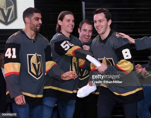 Pierre-Edouard Bellemare, Erik Haula and Brad Hunt of the Vegas Golden Knights joke with teammate Jonathan Marchessault as he is introduced at the...