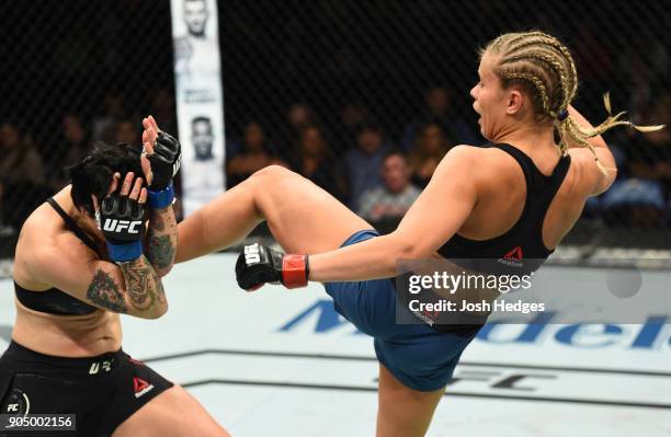 Paige VanZant kicks Jessica-Rose Clark of Australia in their women's flyweight bout during the UFC Fight Night event inside the Scottrade Center on...