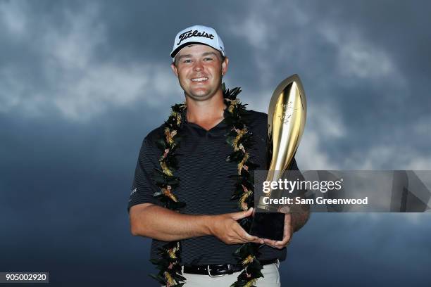 Patton Kizzire of the United States poses with the trophy after winning the Sony Open In Hawaii on the sixth playoff hole against James Hahn at...