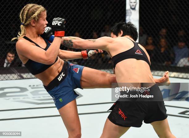 Jessica-Rose Clark of Australia punches Paige VanZant in their women's flyweight bout during the UFC Fight Night event inside the Scottrade Center on...