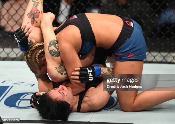 Jessica-Rose Clark of Australia attempts to submit Paige VanZant in their women's flyweight bout during the UFC Fight Night event inside the...