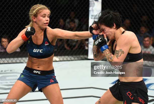 Paige VanZant punches Jessica-Rose Clark of Australia in their women's flyweight bout during the UFC Fight Night event inside the Scottrade Center on...