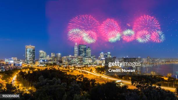 spectacular fireworks over perth skyline - perth skyline stock pictures, royalty-free photos & images