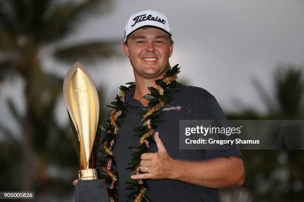 Patton Kizzire of the United States poses with the trophy after winning the Sony Open In Hawaii on the sixth playoff hole against James Hahn at...