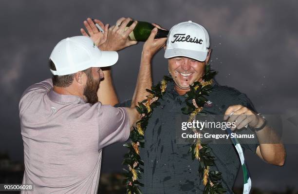 Patton Kizzire of the United States celebrates with Chris Kirk after winning the Sony Open In Hawaii on the sixth playoff hole against James Hahn at...