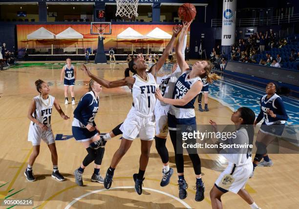Rice guard/forward Nicole Iademarco rebounds against FIU forward Kiandre'a Pound during a college basketball game between the Rice University Owls...