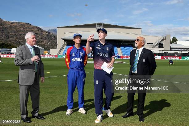 Captains Lohan Louwrens of Namibia and Harry Brook of England take part in the coin toss ahead of the ICC U19 Cricket World Cup match between England...