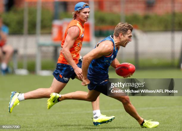 Jed Anderson and Shaun Higgins of the Kangaroos in action during a North Melbourne Kangaroos Training Session at Arden Street Ground on January 15,...